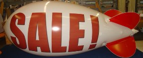 advertising blimp with Sale lettering